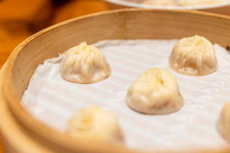 Chinese style steamed soup bun in restaurantの写真素材