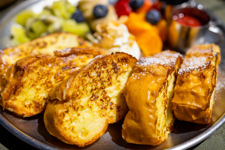 Grill toast with egg and fruit in coffee shop