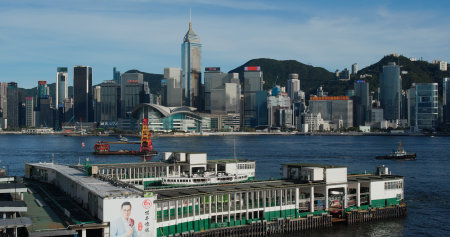 Victoria Harbor, Hong Kong 01 July 2020 : Hong Kong city with pier dockのeditorial素材