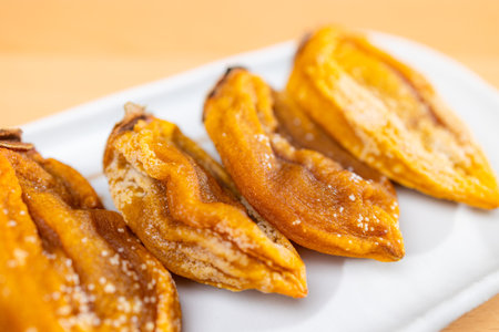 Dried persimmon on the plateの写真素材