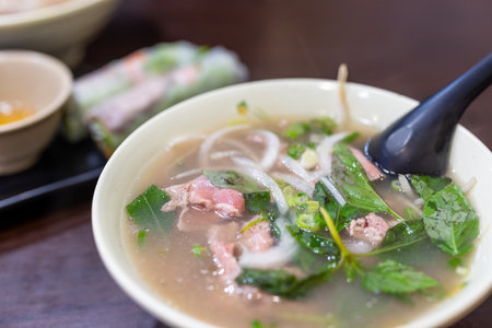 Vietnamese pho rice noodle with raw beef