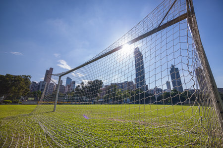 Football net in the court with sunlight flareの写真素材