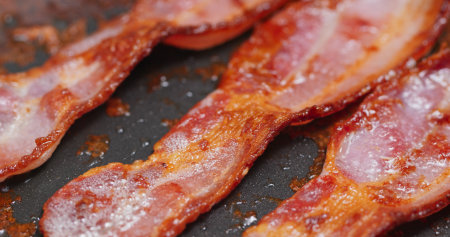 Cook with bacon on fry panの写真素材