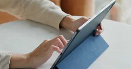 Woman uses tablet computer