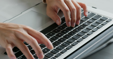 Type on laptop computer, work from homeの写真素材