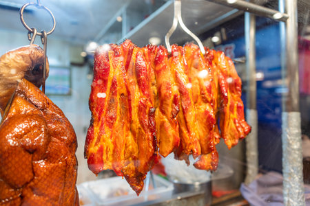 Chinese restaurant traditional gourmet roast goose hanging up in the kitchenの写真素材