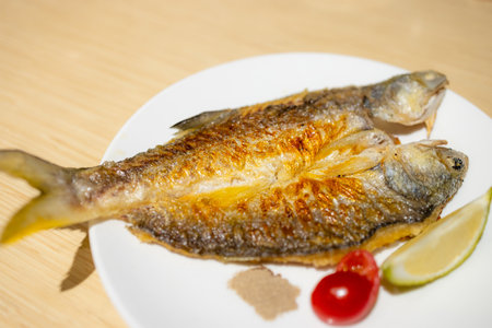 Delicious grill fish dish in restaurantの写真素材