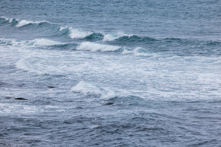 Sea wave splash over the rock beach