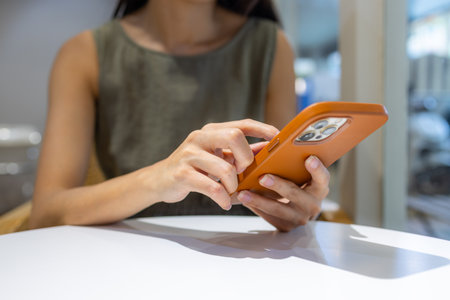 Woman use mobile phone in cafe