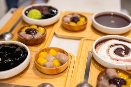 Traditional Taiwanese Dessert with brown sugar jelly, sweet potato and boba eating with snow iceの写真素材