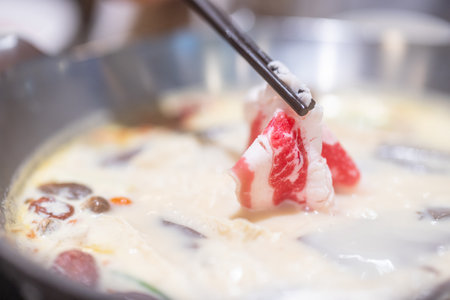Taiwan spicy duck blood hot pot soup with slice of beef