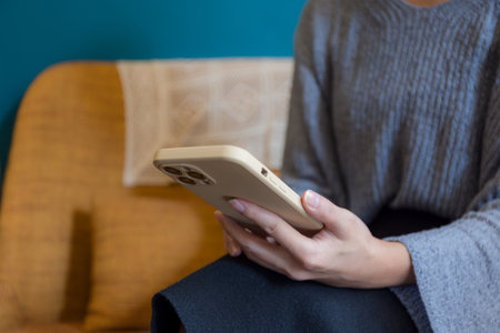 Woman use mobile phone at cafeの写真素材