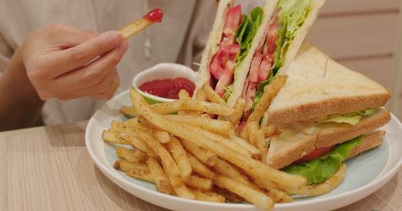 Sandwich and french fires in restaurant