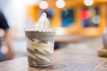 Vegan ice cream with black sesame sauceの写真素材