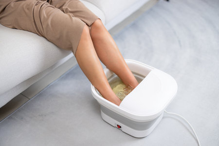 Woman enjoy footbath at homeの写真素材