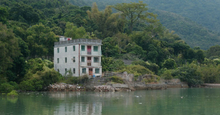 Old house on island beside the seaの写真素材