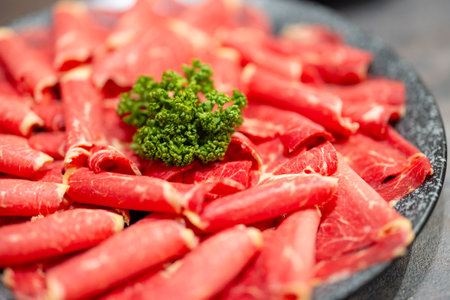 Slice of the fresh raw beef for shabu shabuの写真素材