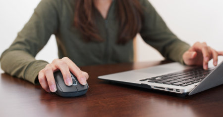 Woman work on laptop computer at homeの写真素材