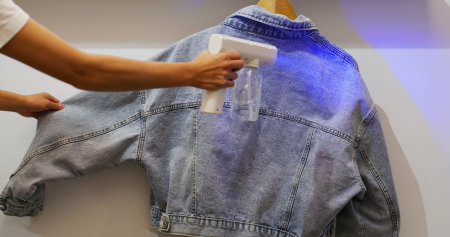 UV Light alcohol spray for cleaning the blue jean jacketの写真素材
