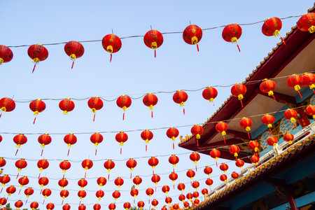 Chinese red lantern hanging up over the skyの写真素材