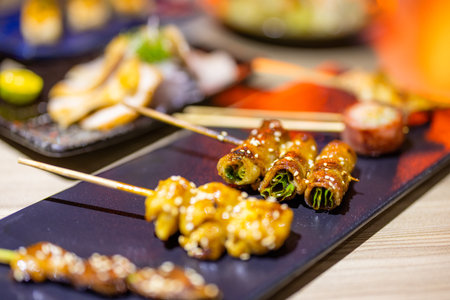 Japanese restaurant with lots of different grilled Skewerの写真素材