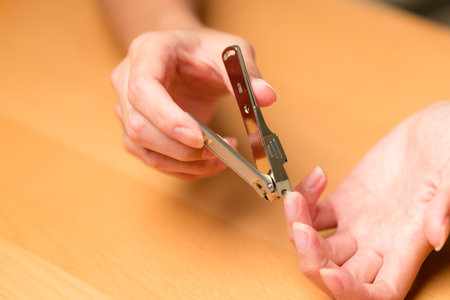 Hand manicure with nail clipperの写真素材