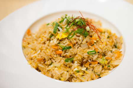 Fried rice on a white plate with dries shrimpの写真素材