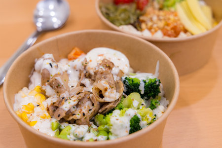 Pork and vegetable rice poke bowlの写真素材