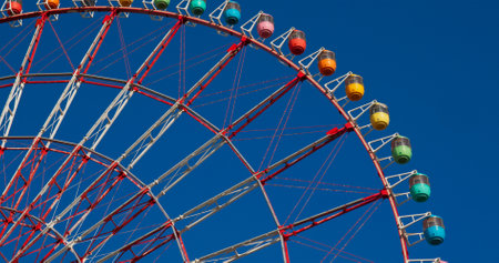 Ferris Wheel with clear blue sunny skyの写真素材