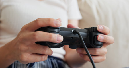 Woman play tv game at home