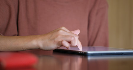 Woman using tablet on tableの写真素材