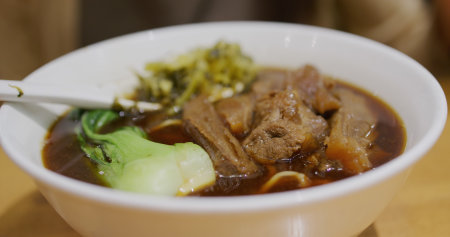 Taiwanese beef noodle soup in restaurantの写真素材