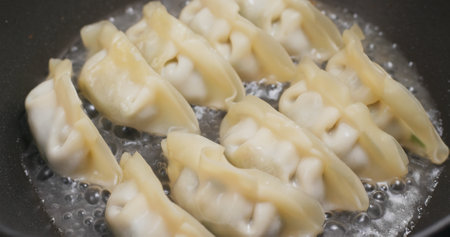 Fry meat dumpling in skillet panの写真素材