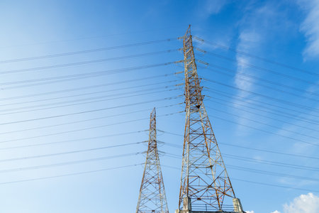 Pylon and high voltage powerline over the blue sky