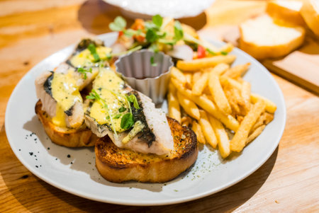 Butter bread toast with sea bass fillet in the restaurant