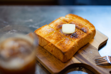 Delicious buttered toast on a plateの写真素材