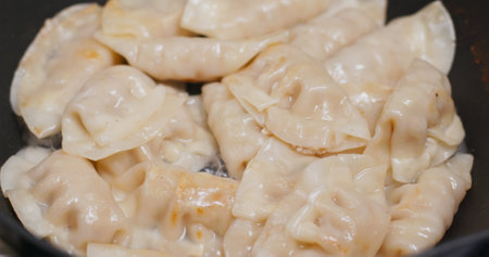 Cook meat dumpling on fry panの写真素材