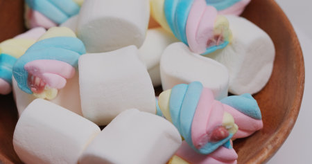 Sweet candy Marshmallow on wooden plateの写真素材