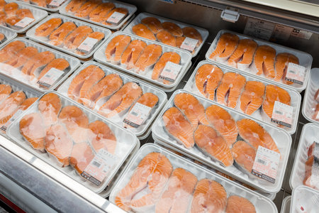 Taiwan 22 September 2023: Shelves with fresh salmon in supermarket at costco storeのeditorial素材