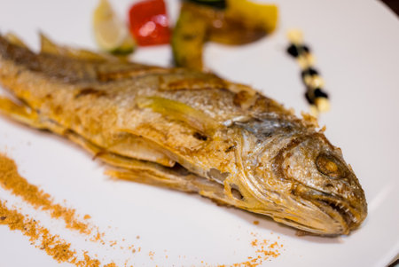 Grill fish on the white plate