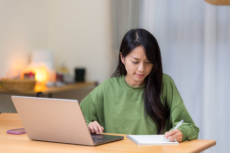Woman study on laptop computer at home