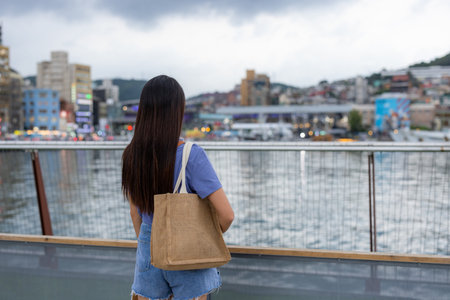 Tourist woman look at the sea in Keelung of Taiwan