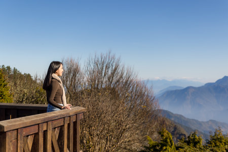 Hike woman look at the mountain viewの写真素材