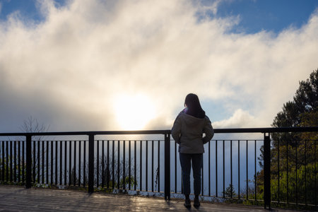 Woman enjoy the sunset view on mountain