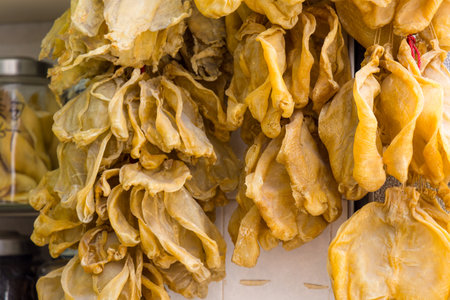Dry fish maw hanging at the store for selling