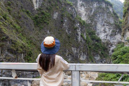 Woman look at the scenery in Hualien taroko Gorge at Taiwanの写真素材