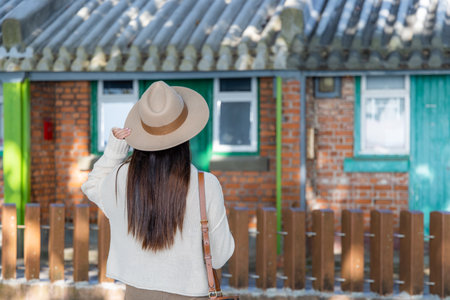 Woman tourist visit Hong Kong old style building houseの写真素材