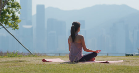 Woman do yoga at parkの写真素材