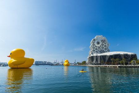 Kaohsiung, Taiwan, 01 February 2024: Kaohsiung Music Center in Taiwan with plastic yellow rubber duckの写真素材