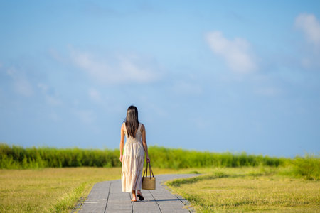 Travel woman walk along the park in chaojing park in Keelung of Taiwanの写真素材